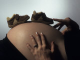 Baby Boy Shoes' on the Tummy of a Nine Month Pregant Woman Photographic Print by Paul Damien