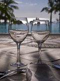 Wine Glasses in Front of the Pool of the Beachcomber Le Paradis, Mauritius, Indian Ocean, Africa Photographic Print by Michael Runkel