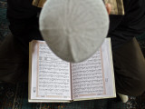 Kyrgyz Man Reads the Koran During a Friday Prayer Inside a Mosque in Osh, Southern Kyrgyzstan Photographic Print