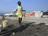 Youth Jumps Rope in a Camp for People Displaced by the Earthquake in Port-Au-Prince Photographic Print