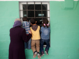 Palestinians Listen from Outside to a Music Band in a Mosque, During Celebrations Marking Nebi Musa Photographic Print