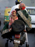 Family Rides on a Two-Wheeler in New Delhi, India Photographic Print