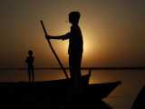 Boatman Prepares to Anchor His Boat, after the Day's Work in River Ganges, in Allahabad, India Photographic Print