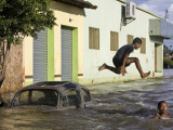 Children Play in a Flooded Street in Trizidela Do Vale, Maranhao State, Brazil Photographic Print