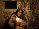 Elderly Woman Holds a Candle as She Takes Part in a Procession During Holy Week in Taxco, Mexico Photographic Print