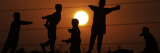 Refugee Children Playing on a Railway Near their Camp at Sunset, in Islamabad, Pakistan Photographic Print