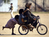 Girls Play on a Bike in Jammu, India Photographic Print