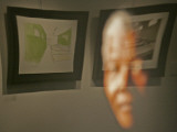 Lithograph by Nelson Mandela is Seen Reflected on a Photographic Portrait of Mandela Photographic Print