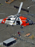 Coast Guard Rescues One from Roof Top of Home, Floodwaters from Hurricane Katrina Cover the Streets Fotografie-Druck