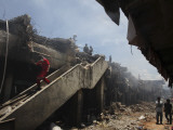 Indonesian Rescue Workers Walk on a Eartquake Damaged Building, in Padang, Indonesia Photographic Print