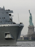 USS New York Passes the Statue of Liberty While Fireboats Spray Water in New York Photographic Print