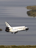 Space Shuttle Discovery Glides over the Banana River to a Landing on Kennedy Space Center's Runway Photographic Print