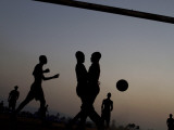 People Play Soccer at a Camp Set Up for Earthquake Survivors Left Homeless in Port-Au-Prince Photographic Print