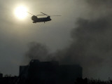 Helicopter Flies Above the Building Where a Plane Crashed in Tehran, Iran Lámina fotográfica