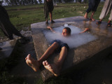 Youth Swims in a Water Reservoir as the Temperature Rises, on the Outskirts of Islamabad, Pakistan Photographic Print