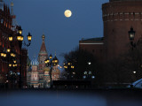 Moon is Seen over the Red Square in Moscow with the St. Basil Cathedral in the Background Photographic Print