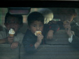 Afghan Boys Eat Ice Cream as They Sit Inside a Van in Kabul, Afghanistan Photographic Print