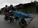 Children Push a Wheelbarrow as They Return Home in the Outskirts of Kabul, Afghanistan Photographic Print