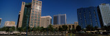 Skyscrapers in a City, Abu Dhabi Marine Operating Company, Abu Dhabi, United Arab Emirates Lámina fotográfica por Panoramic Images Skyscrapers in a City, Abu Dhabi Marine Operating Company, Abu Dhabi, United Arab Emirates Lámina fotográfica por Panoramic Images