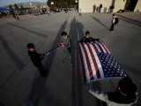 School Children Prepare to Raise the US and Texas Flags in Front of the Elementary School Lámina fotográfica
