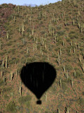 Navigating His Hot Air Balloon Near Tucson Mountain Range During a Sunrise Flight Easter Morning Photographic Print