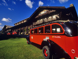 Red Jammer Buses Parked in Front of Glacier Park Lodge in East Glacier, Montana, USA Photographic Print by Chuck Haney