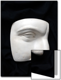A Cut Out of a Sculpture Including a Man's Face Art by E.S. 