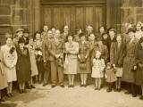 A Wartime Wedding Group Pose in Front of Church Doors Photographie par Philip Talmage
