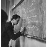 A Teacher Writing on a Blackboard at Northfield House Junior School, Leicester Photographic Print by Henry Grant