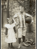 Girl and Boy Play Football Photographic Print