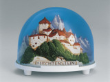Close-Up of a Figurine of a Castle on a Mountain in a Snow Globe Photographic Print