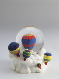 Close-Up of a Figurine of a Hot Air Balloon in a Snow Globe Photographic Print