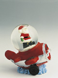 Close-Up of a Figurine of a Santa Claus on an Airplane in a Snow Globe Photographic Print