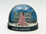 Close-Up of a Figurine Rossella Ohara in Front of a Building in a Snow Globe Photographic Print