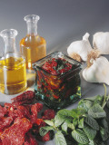 Close-Up of Vegetables and Oil in Bottles Photographic Print by N. Banas