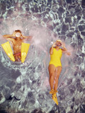 Couple Diving in Swimming Pool Photographic Print by Dennis Hallinan