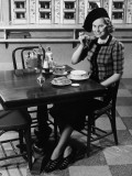 Woman in Fancy Hat Eating Breakfast in Bar Photographic Print by George Marks