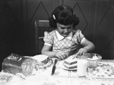 Girl (6-7) Spreading Butter on Slice of Toast Fotografie-Druck von George Marks