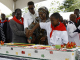 Zimbabwean President Robert Mugabe (L), Photographic Print by Desmond Kwande
