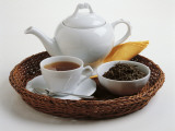 Close-Up of a Teapot and a Tea Cup with Saucer in a Tray Photographic Print by I. Taborri