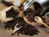 Close-Up of Coffee Beans Spilling from a Sack Photographic Print