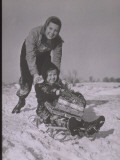 Girl Pushes Child on Sled with Christmas Gifts Fotografie-Druck von Lambert 