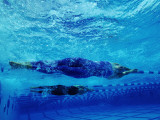 Two Female Swimmers Performing Racing Turns, Underwater View Photographic Print