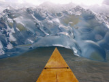 Alaska, Juneau, the Bow of a Mahogany Kayak Noses into an Iceberg Spawned by the Mendenhall Glacier Photographic Print