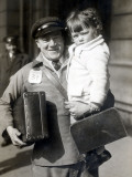 A Porteur in a Railway Station During the Easter Holidays Period Photographic Print