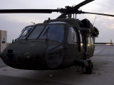 A UH-60 Black Hawk Helicopter on the Flight Line at Dusk in Tikrit, Iraq Photographic Print