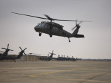 A UH-60 Black Hawk Taking Off for a Mission over Northern Iraq Photographic Print