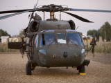 A UH-60L Black Hawk with Twin M240G Machine Guns at the Victory Base Complex in Baghdad, Iraq Lámina fotográfica