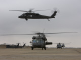UH-60 Black Hawks Taxis Out for a Mission over Northern Iraq Photographic Print