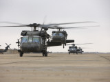 UH-60 Black Hawks Taxis Out for a Mission over Northern Iraq Photographic Print